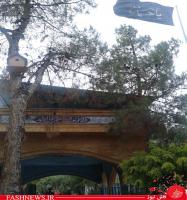پرچم یا حسین برافراشته بر مزار شهدا